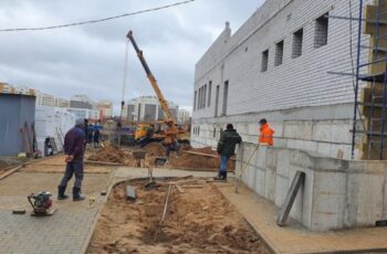 Завершены работы по возведению кирпичных стен многофункционального здания по ул. Кабяка в г. Гродно